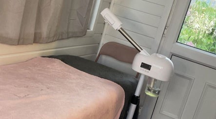 Comfortable treatment room at Tiana Hughes, Castleford, England, GB with spa bed and modern equipment.