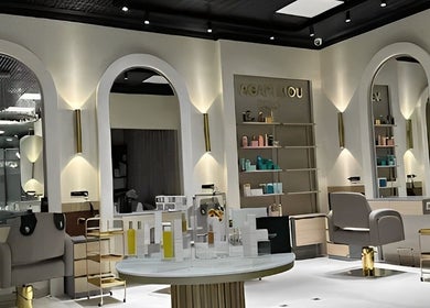 Chic interior of Agapi Mou Beauty World in Yerevan with stylish chairs and illuminated mirrors.