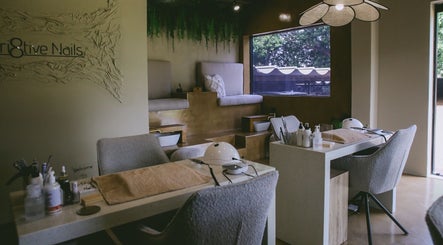 Elegant interior of Kri8tive Nails, Pretoria, Gauteng, ZA, featuring plush seating and nail care stations.