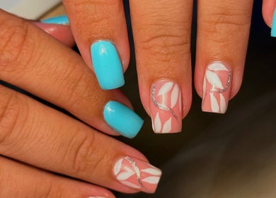 Stylish nail art with aqua and pink designs at Holly’s Beauty, Bridgwater, England, GB.