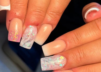 Elegant glitter nail art at Holly’s Beauty, Bridgwater, England, GB showcasing stunning manicure design.