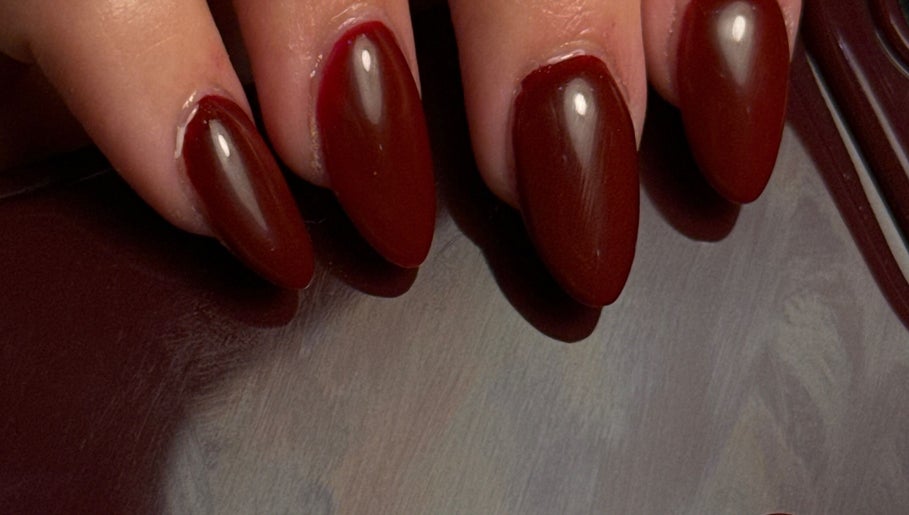 Stylish crimson nails at Holly’s Beauty in Bridgwater, England, GB. Perfect for a bold, elegant look.