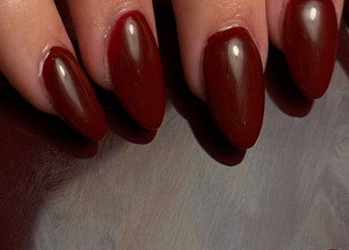 Stylish crimson nails at Holly’s Beauty in Bridgwater, England, GB. Perfect for a bold, elegant look.