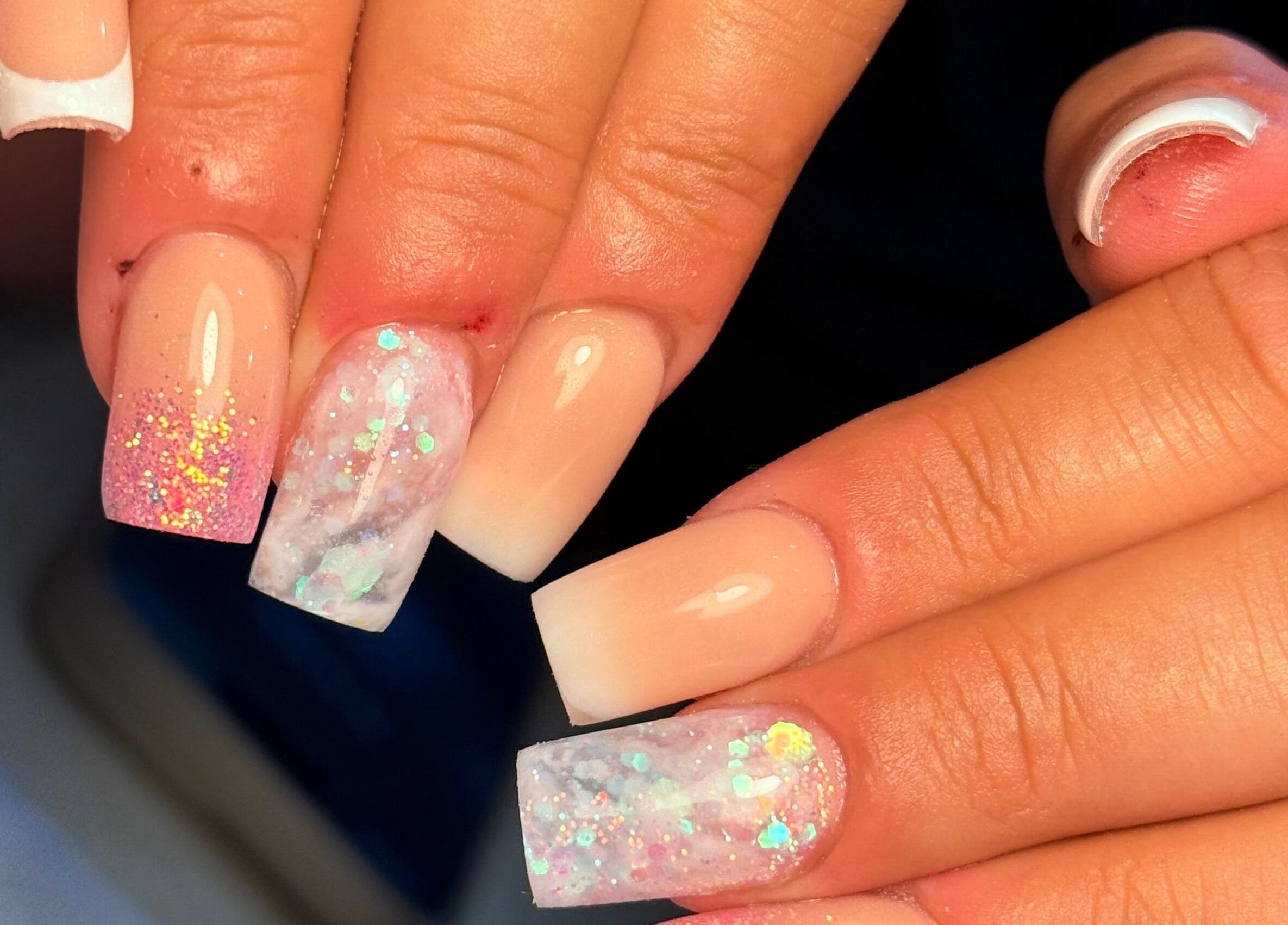 Stunning glitter nail art at Holly’s Beauty, Bridgwater, England, GB. Perfect for stylish elegance.