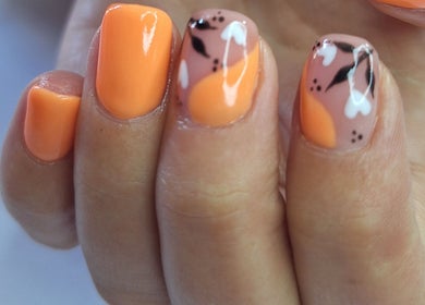 Elegant orange floral nail art by Nails by Lizette in Bloemfontein, Free State, ZA.