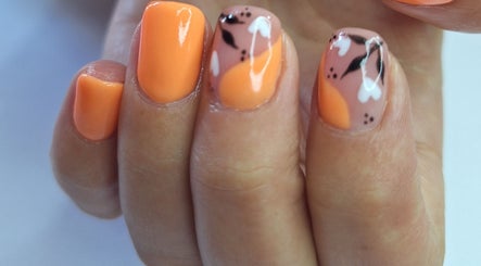 Elegant orange floral nail art by Nails by Lizette in Bloemfontein, Free State, ZA.