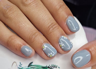 Stylish grey nails with flower design at Nails by Lizette, Bloemfontein, Free State, ZA.