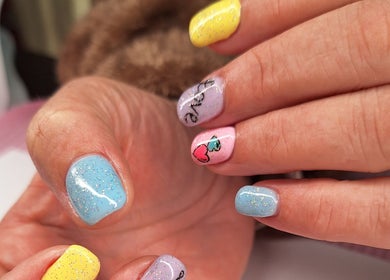 Colorful nail art with glitter at Nails by Lizette, Bloemfontein, Free State, ZA.