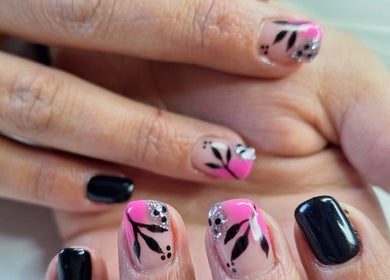 Stylish black and pink floral nail art at Nails by Lizette, Bloemfontein, Free State, ZA.