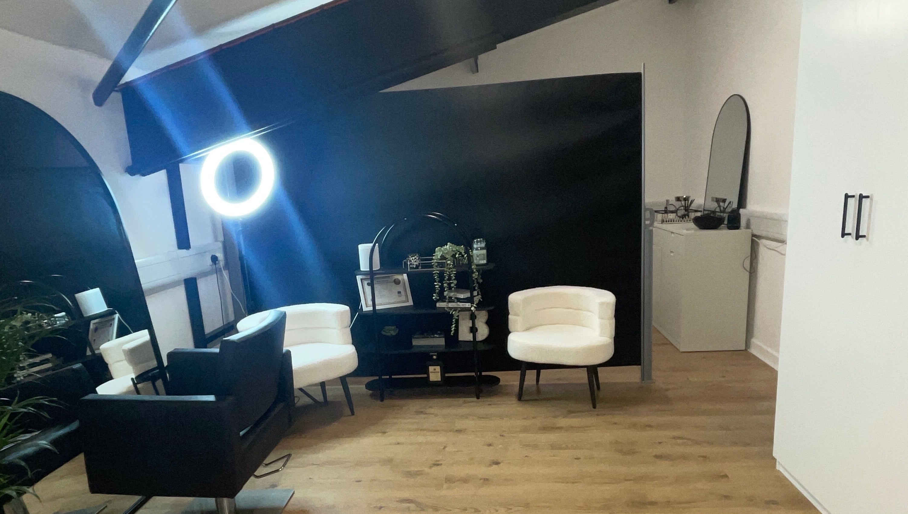 Sophisticated interior of Jack Anthony Aesthetics, London, England, GB, featuring chic chairs and modern decor.