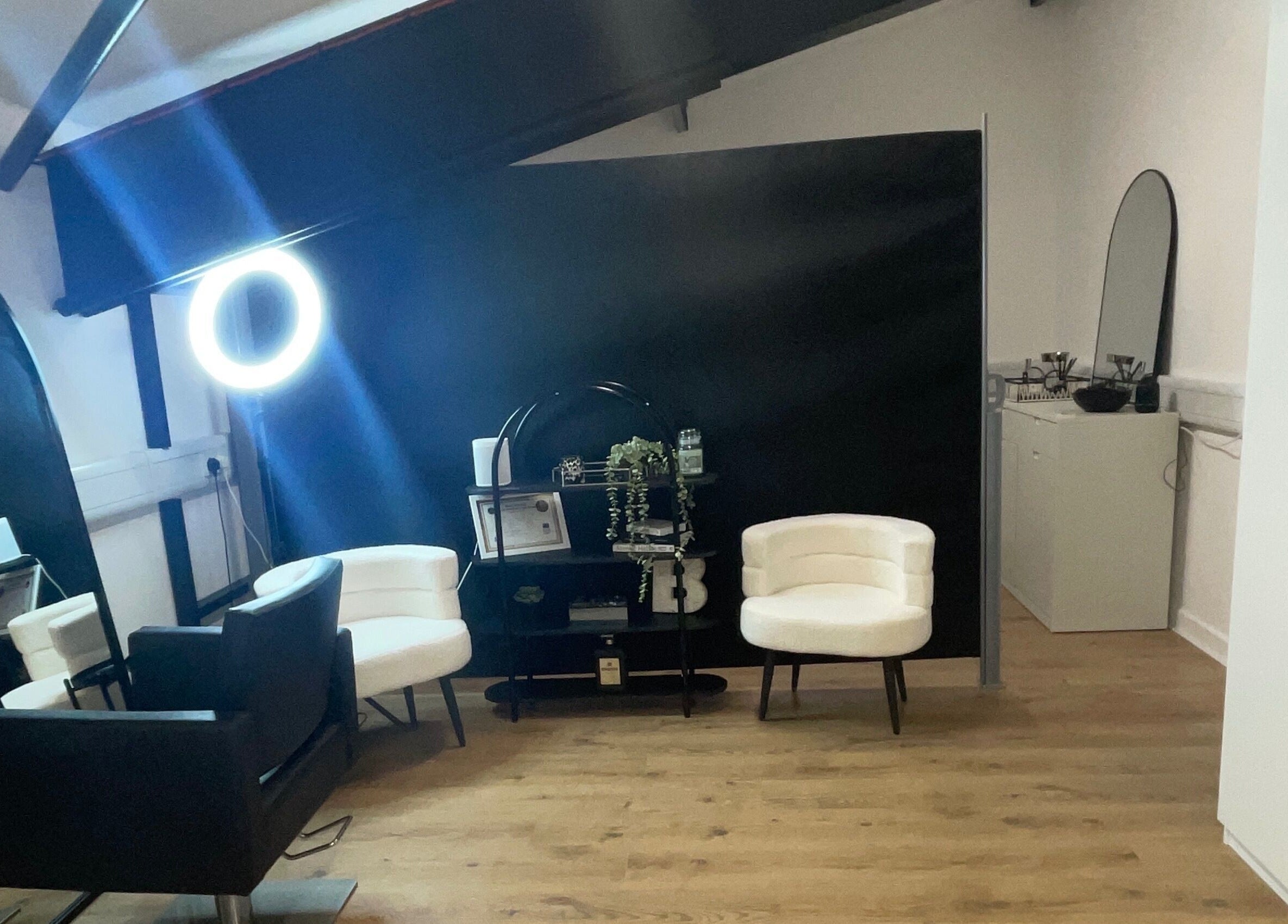 Sophisticated interior of Jack Anthony Aesthetics, London, England, GB, featuring chic chairs and modern decor.