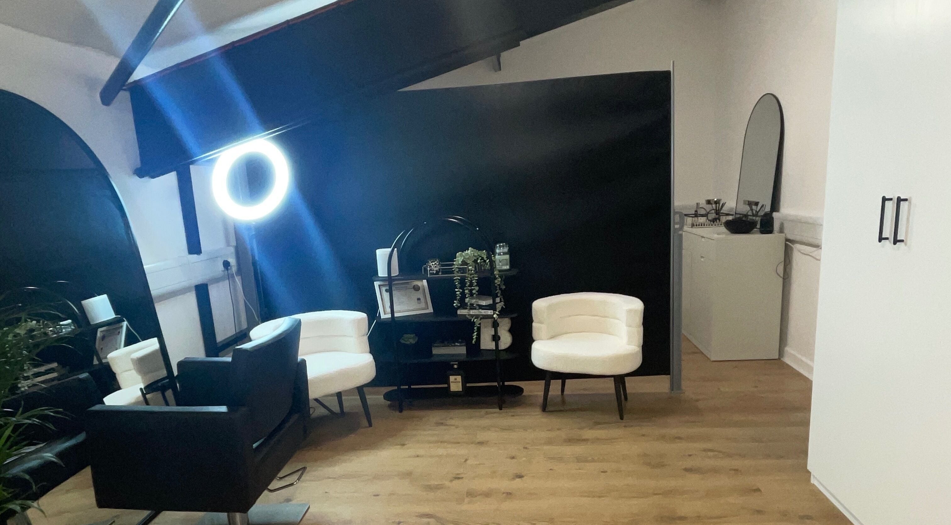 Sophisticated interior of Jack Anthony Aesthetics, London, England, GB, featuring chic chairs and modern decor.