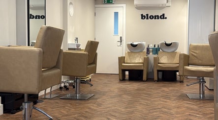 Leon James Hair salon interior in Sarisbury Green, England, GB, featuring stylish leather chairs and washing stations.