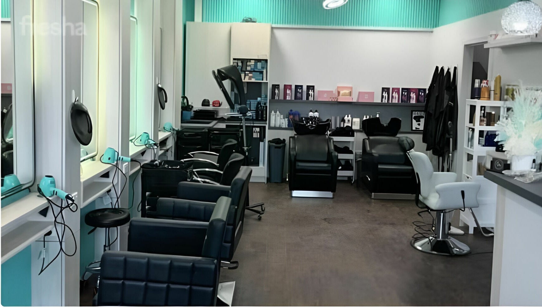 Modern interior of Anita & Co Hair & Beauty in Cranbourne, Victoria, AU. Stylish chairs and equipment displayed.