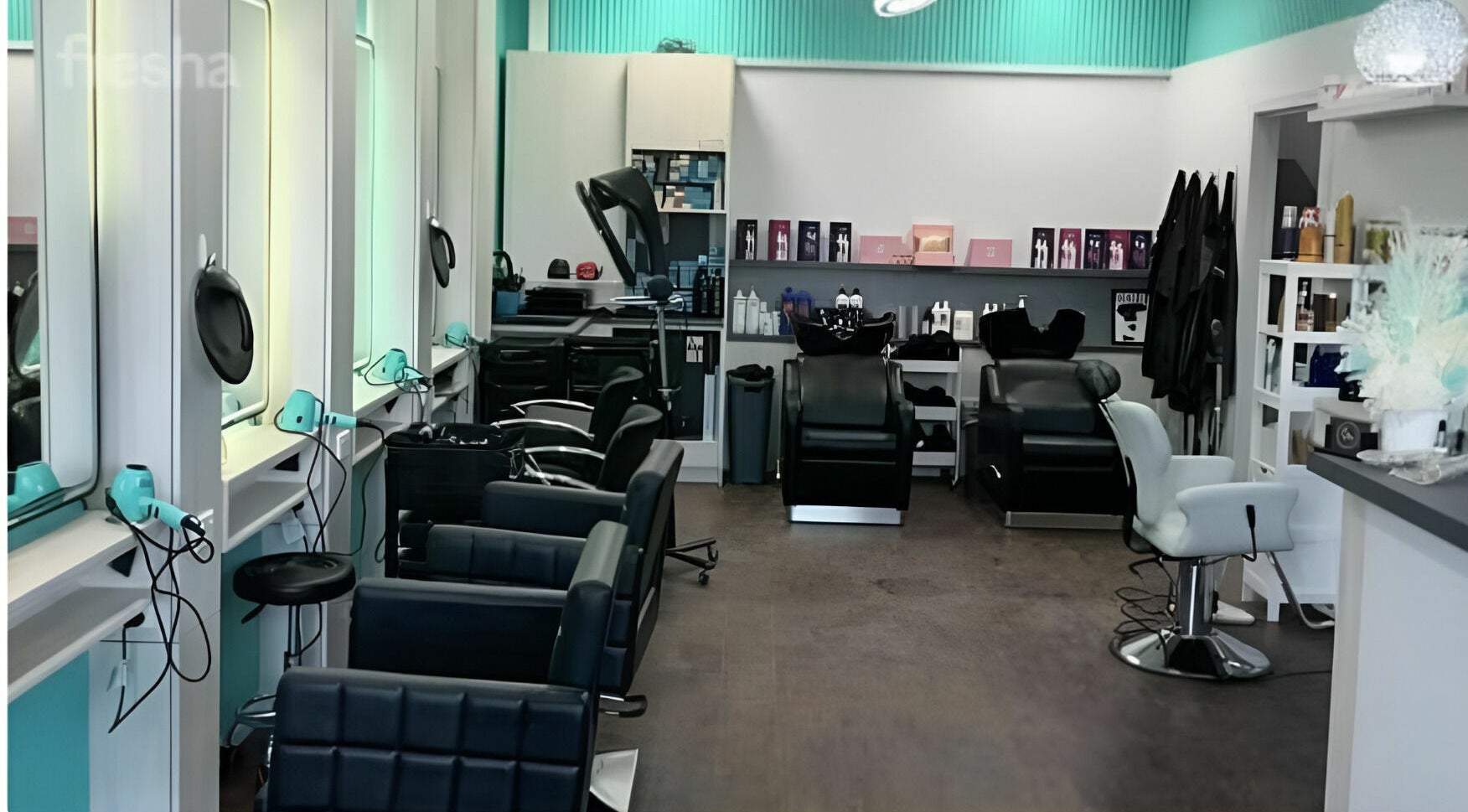 Modern interior of Anita & Co Hair & Beauty in Cranbourne, Victoria, AU. Stylish chairs and equipment displayed.