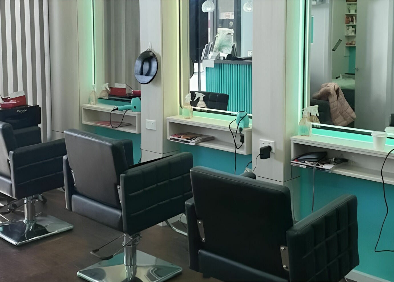 Modern salon chairs and mirrors at Anita & Co Hair & Beauty, Cranbourne, Victoria, AU.