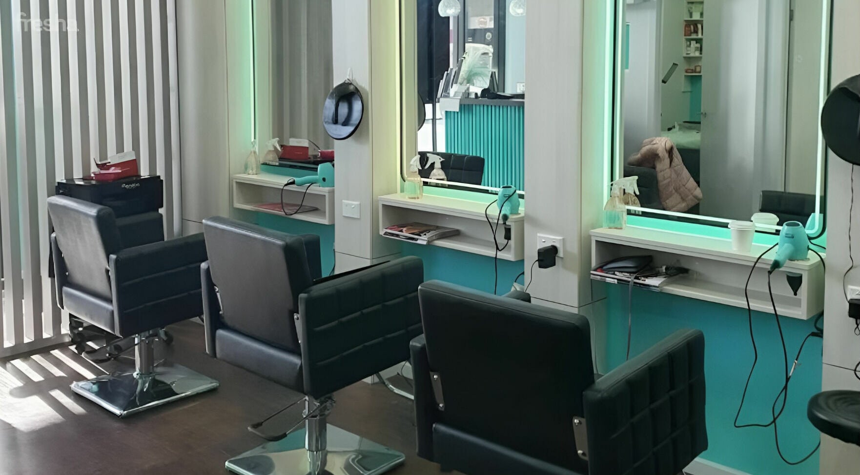 Modern salon chairs and mirrors at Anita & Co Hair & Beauty, Cranbourne, Victoria, AU.