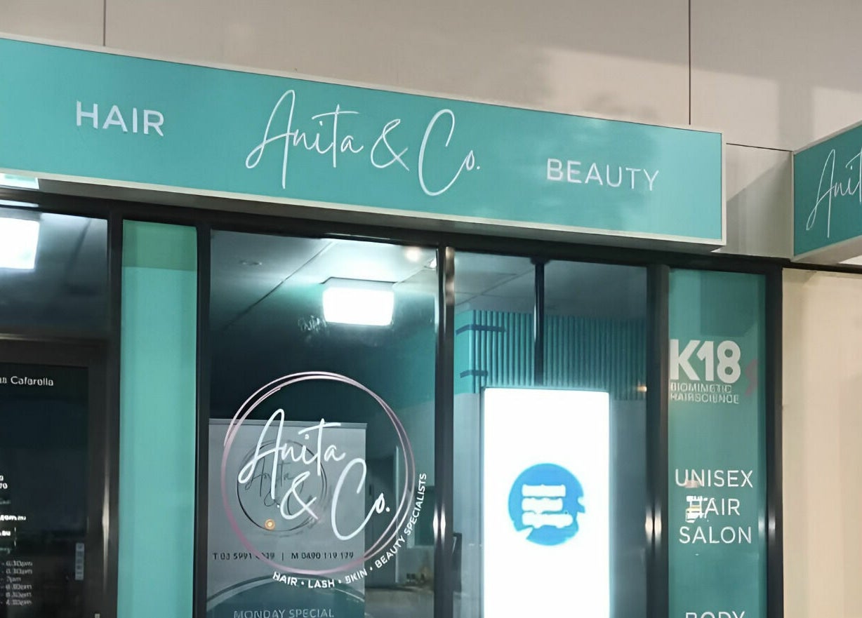 Entrance of Anita & Co Hair & Beauty in Cranbourne, Victoria, AU with elegant signage.