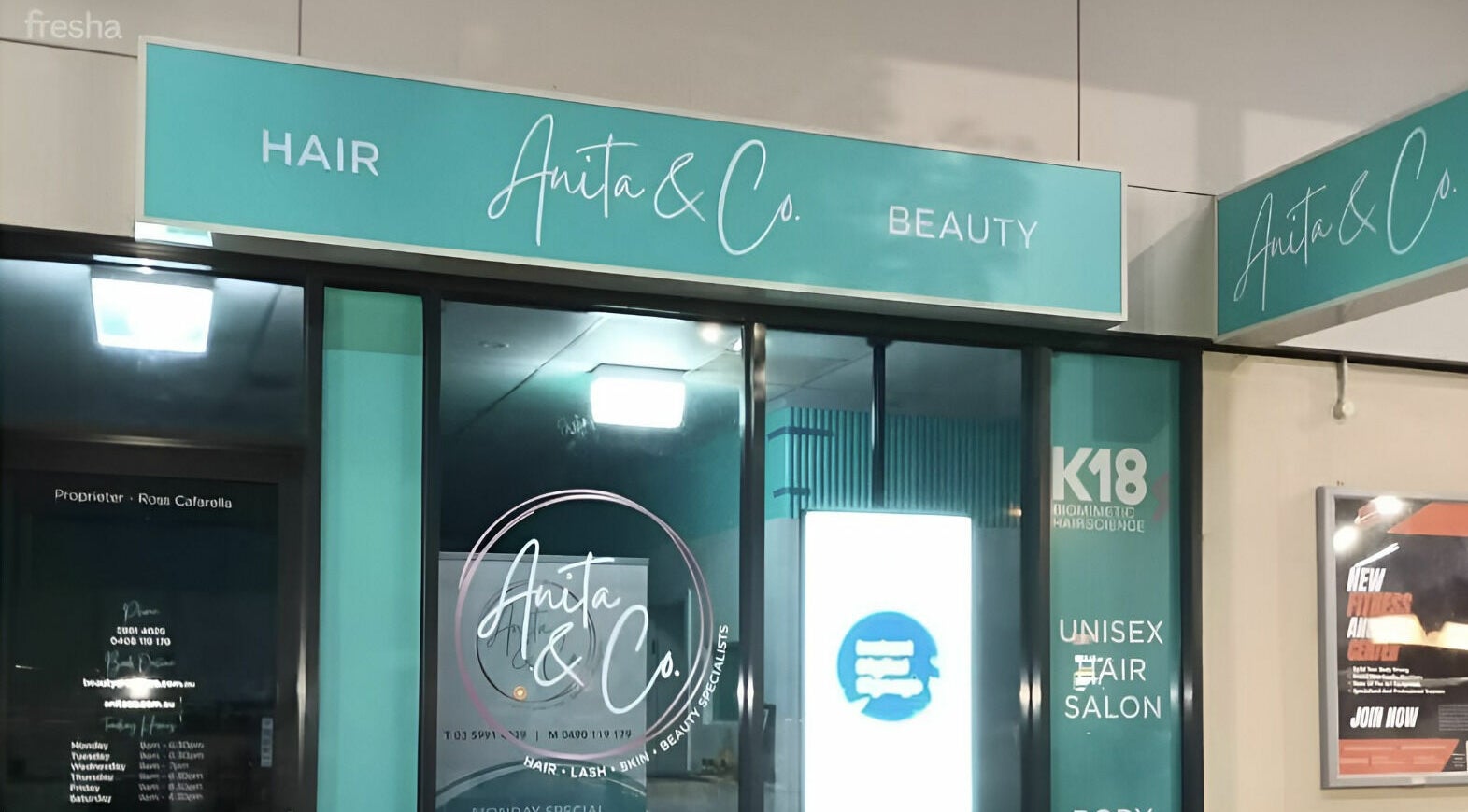 Entrance of Anita & Co Hair & Beauty in Cranbourne, Victoria, AU with elegant signage.