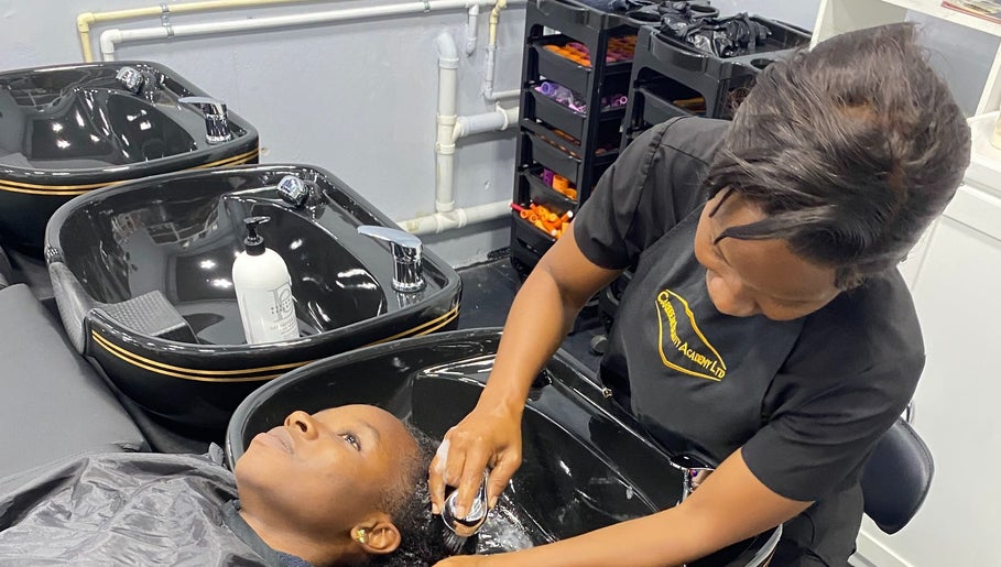 A stylist washes a client's hair at Hava's Beauty Bar, Port of Spain, enhancing relaxation and care.