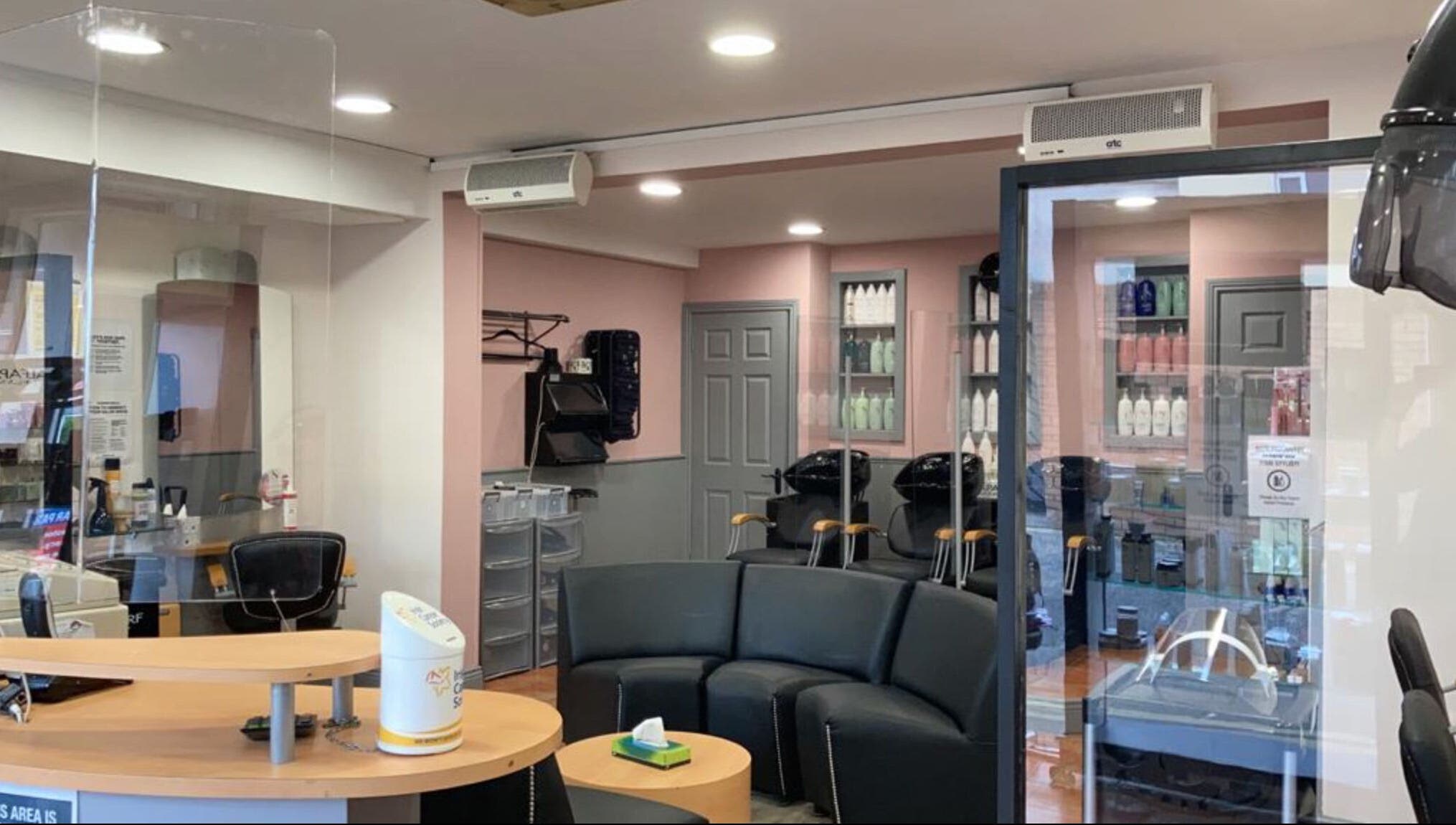 Elegant interior of Headcases Hair Salon in Ashbourne, IE, featuring modern decor and comfortable seating.