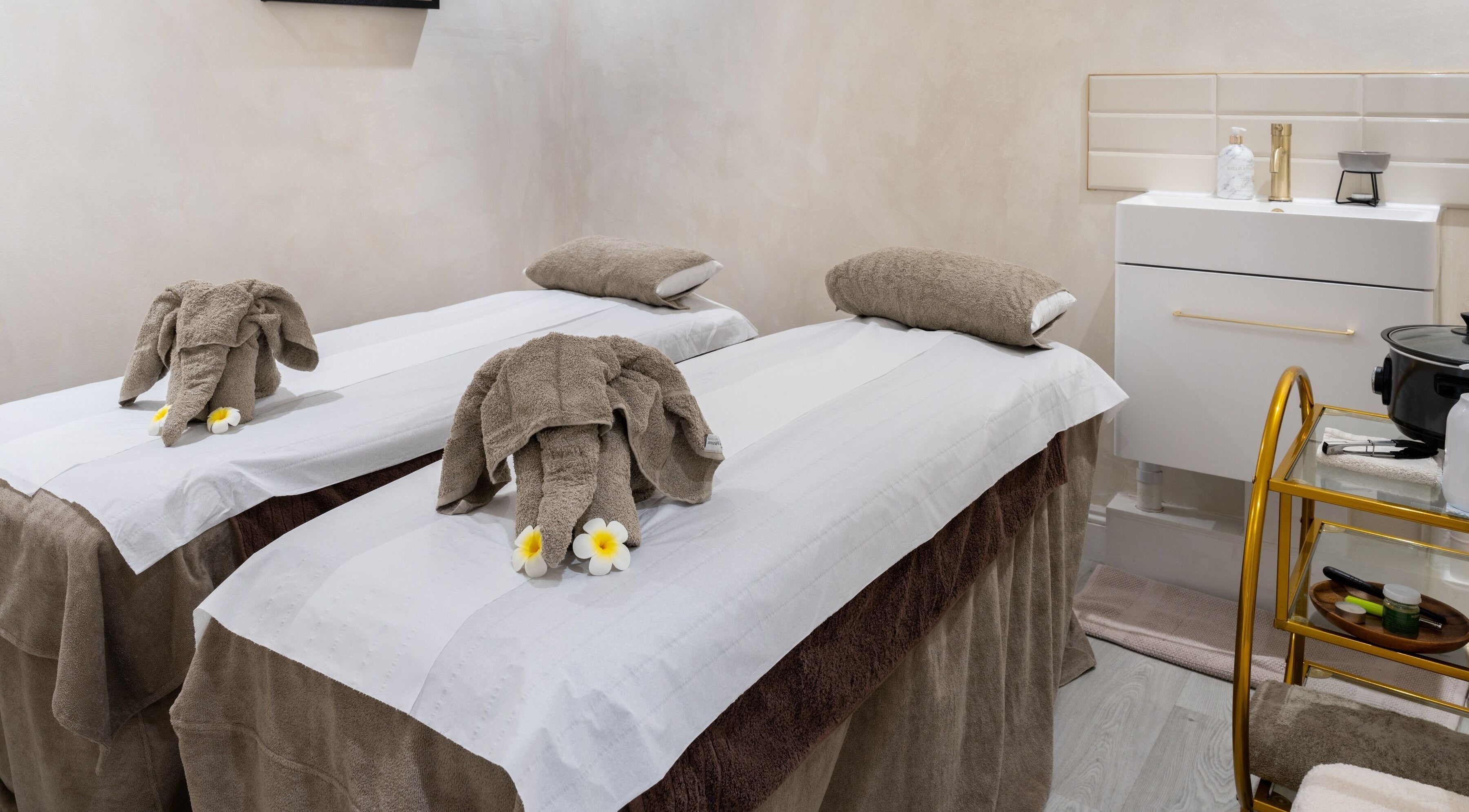 Luxury spa beds with elephant towel art at Barnes Village Spa, London, England, GB.