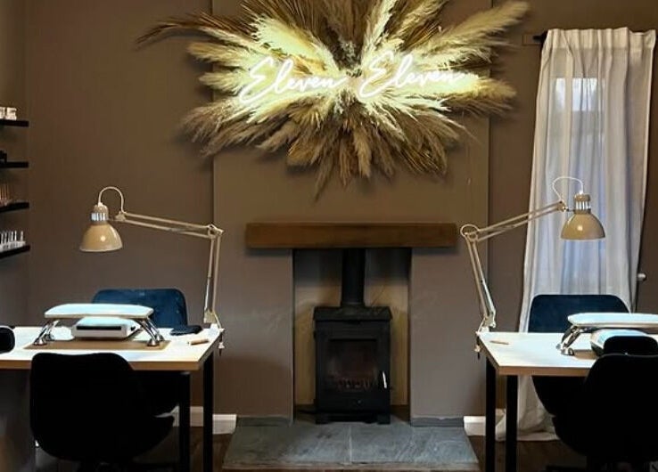 Cozy nail salon setup at The Lash Artist at 11:11, Prestatyn, Wales, GB with elegant decor and modern workstations.