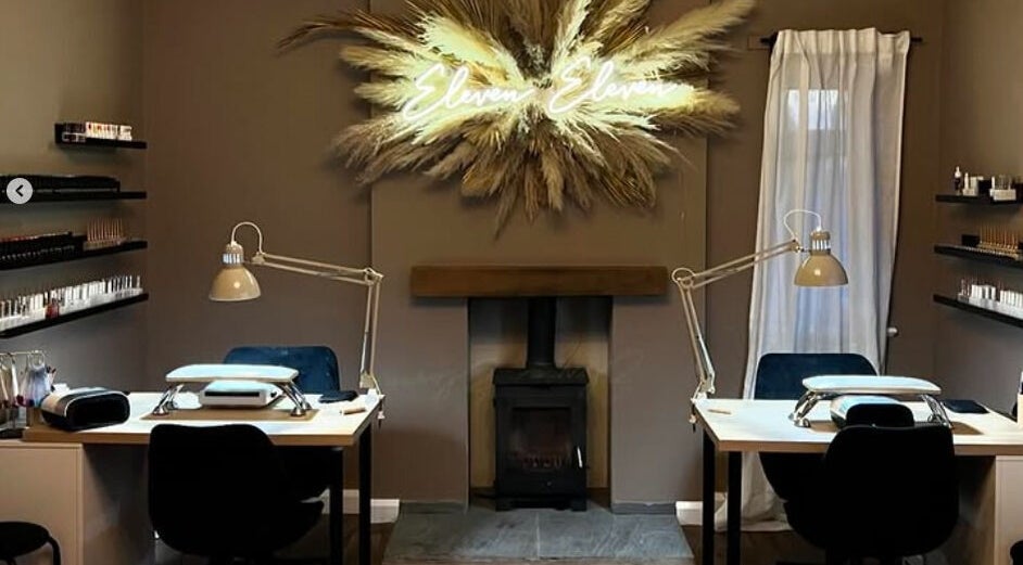 Cozy nail salon setup at The Lash Artist at 11:11, Prestatyn, Wales, GB with elegant decor and modern workstations.
