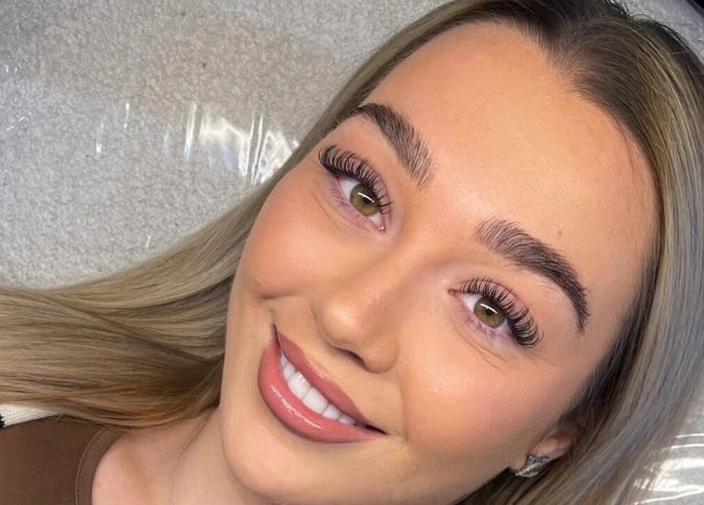 Smiling client showcasing perfect lashes at The Lash Artist at 11:11, Prestatyn, Wales, GB.