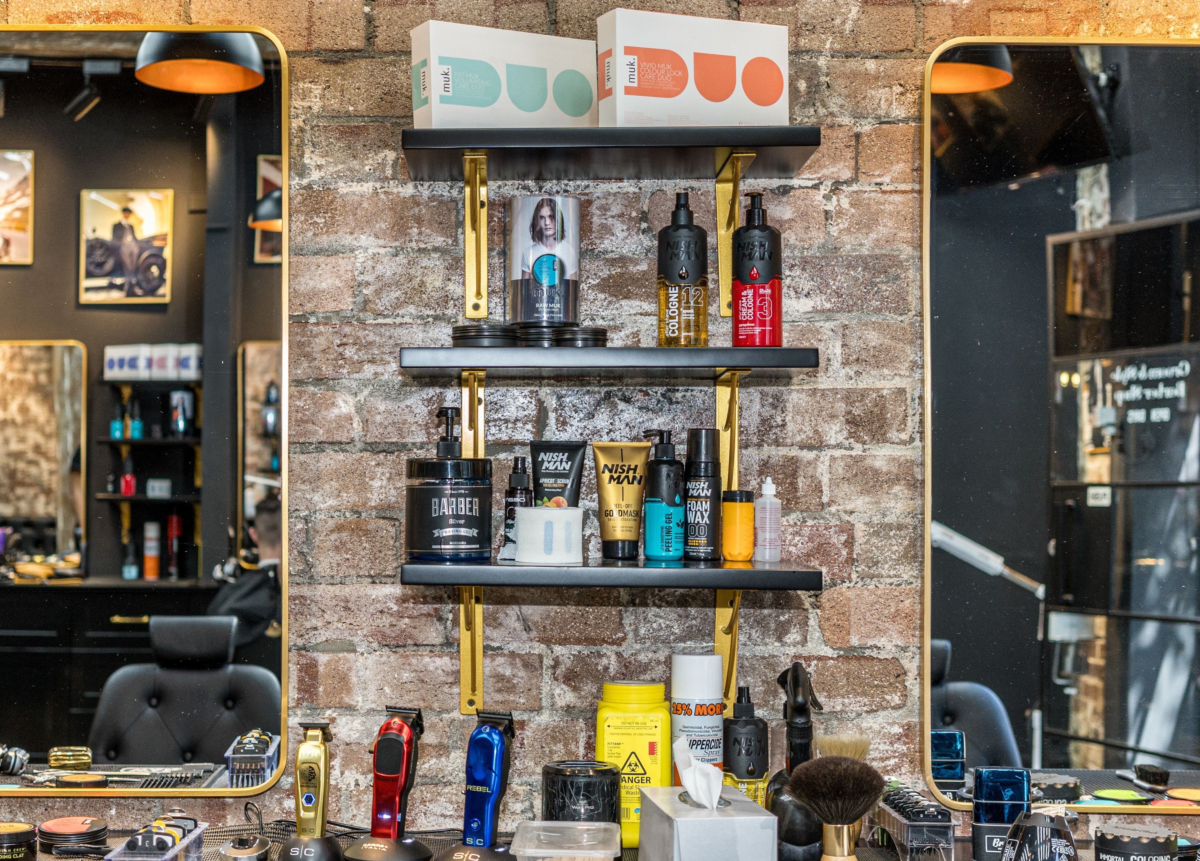 Stylish shelves with grooming products at Groom & Style Barber Shop, Waterloo, New South Wales, AU.