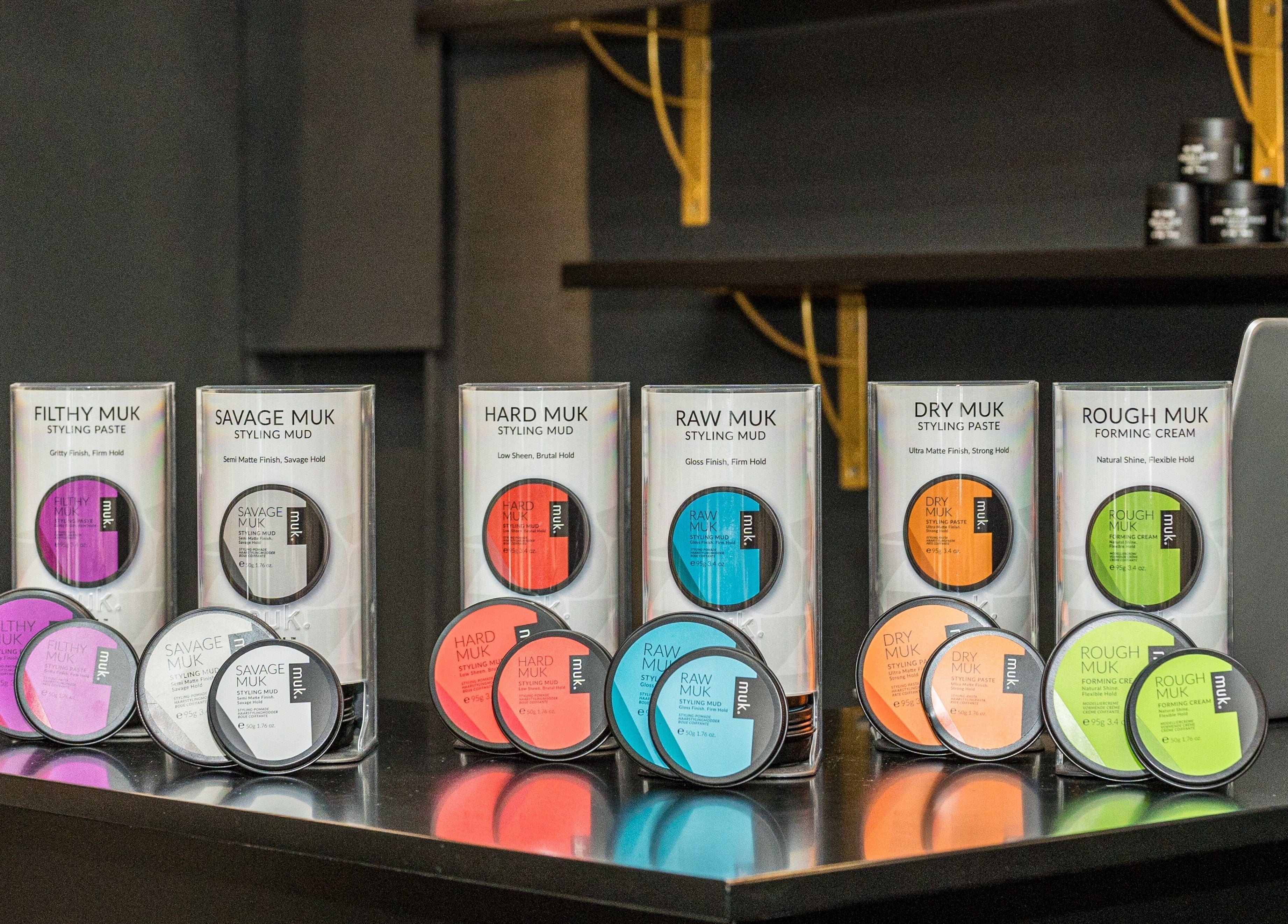 Variety of Muk hair styling products on display at Groom & Style Barber Shop in Waterloo, New South Wales, AU.