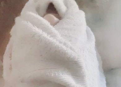 Cozy white towel wrap at Skin by Gigi, offering relaxation in Parma Heights, Ohio, US.