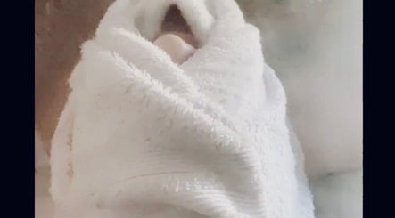 Cozy white towel wrap at Skin by Gigi, offering relaxation in Parma Heights, Ohio, US.