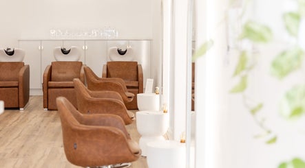 Elegant salon chairs at Flourish Eco Hair, Subiaco, Western Australia, AU, highlighting eco-friendly design.