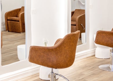 Flourish Eco Hair salon in Mount Lawley, Western Australia featuring elegant wooden styling chairs.
