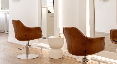 Elegant brown salon chairs at Flourish Eco Hair, Mount Lawley, Western Australia, AU.