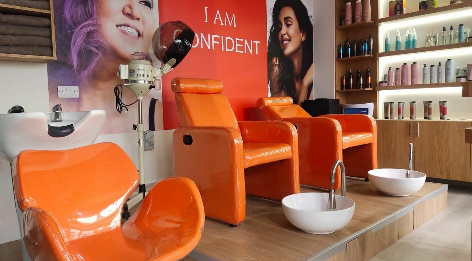 Bright orange chairs and beauty setup at Maya Beauty Salon, Dubai, Dubai, AE, showcasing elegance and comfort.