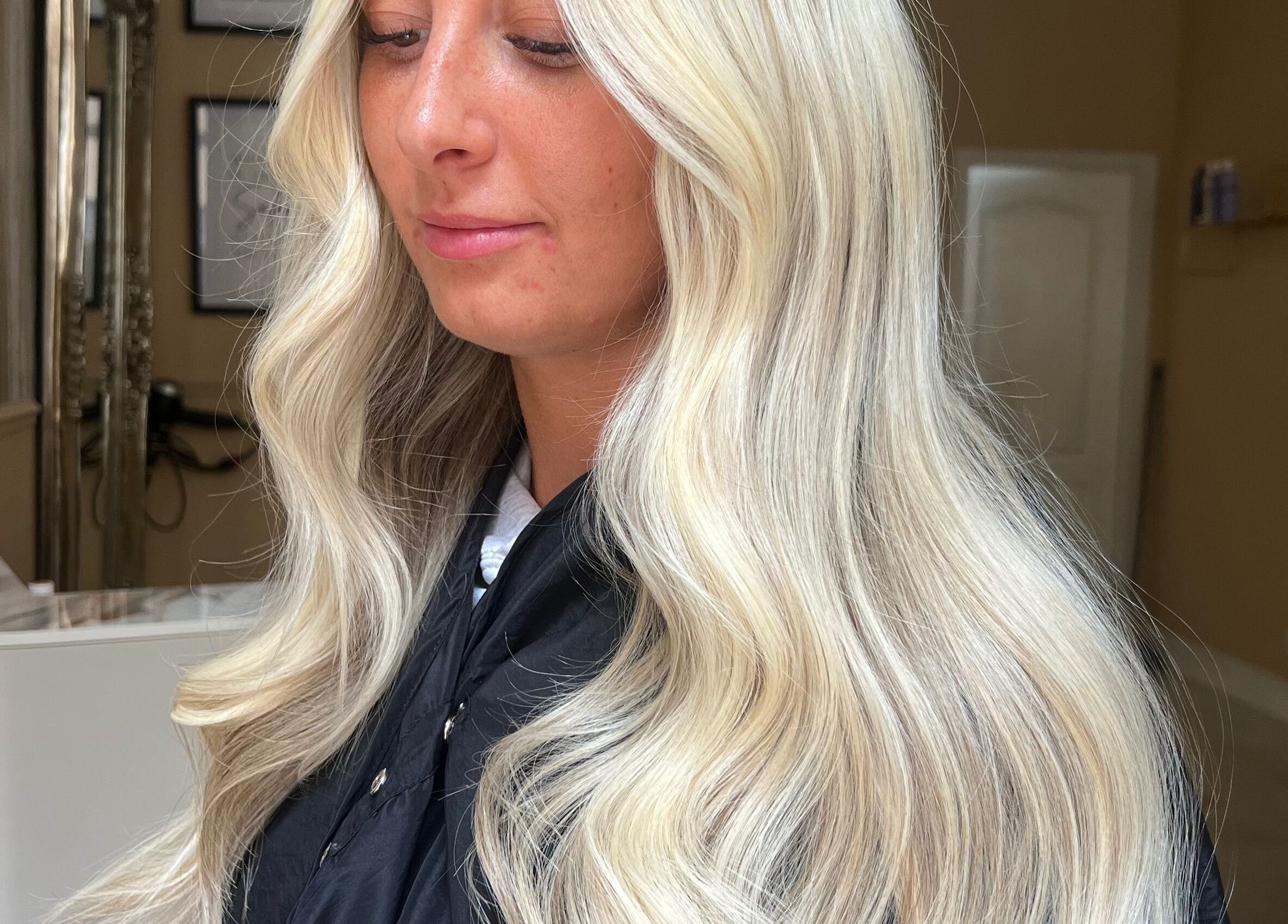 Elegant blonde curls styled at Iona McLauchlan Hairdressing in Stirling, Scotland, GB.