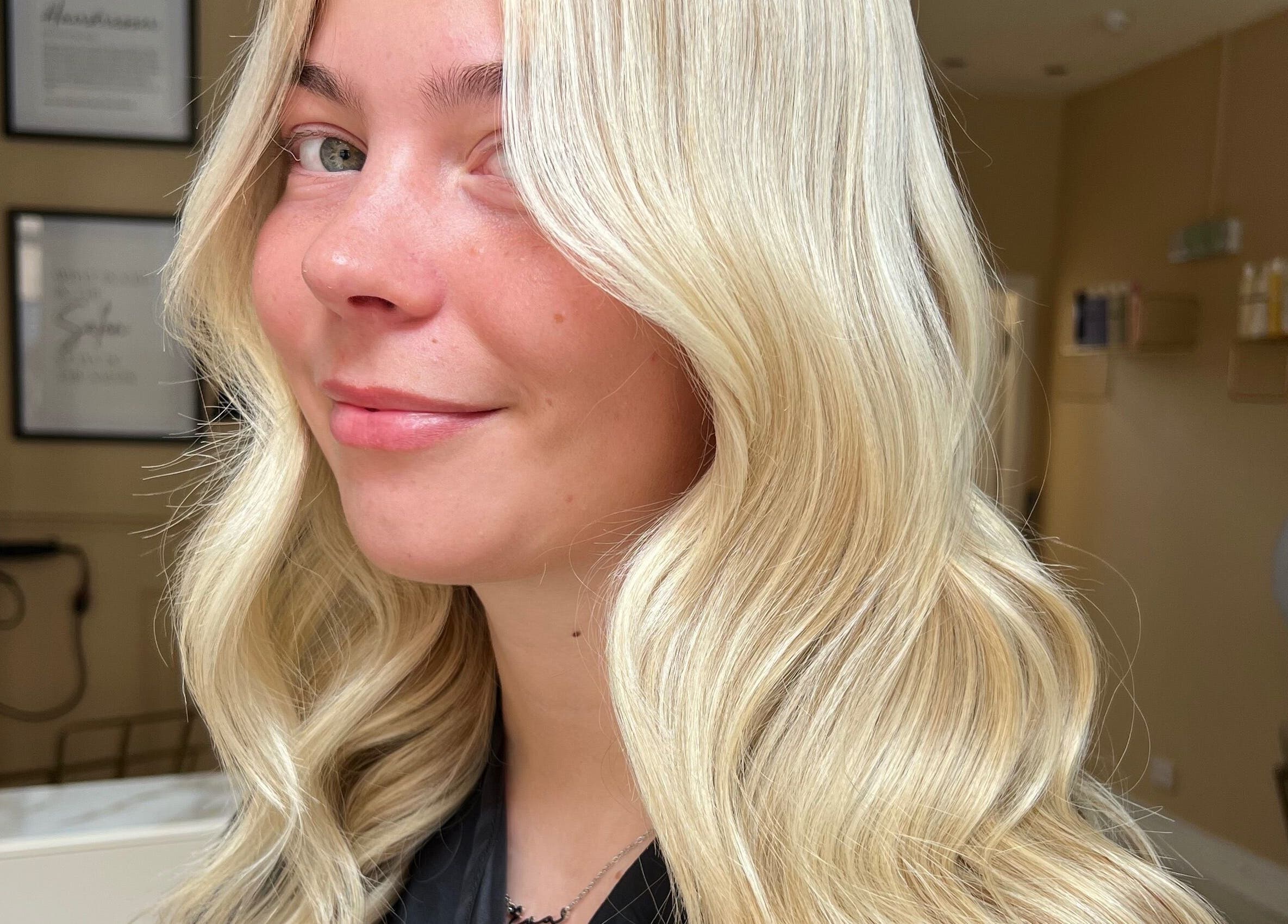 Elegant blonde hairstyle at Iona McLauchlan Hairdressing in Stirling, Scotland, GB, showcasing professional styling.