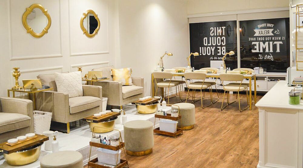 Luxurious spa lounge with gold accents at Elk and Doe Inc, Toronto, Ontario, CA for beauty treatments.