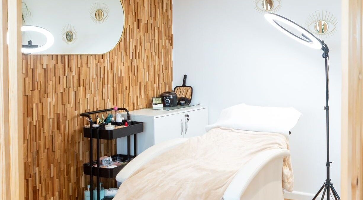 Tranquil treatment room at Salt Salon | Hair Beauty Aesthetics, Newquay, England, GB, with cozy bed and chic decor.