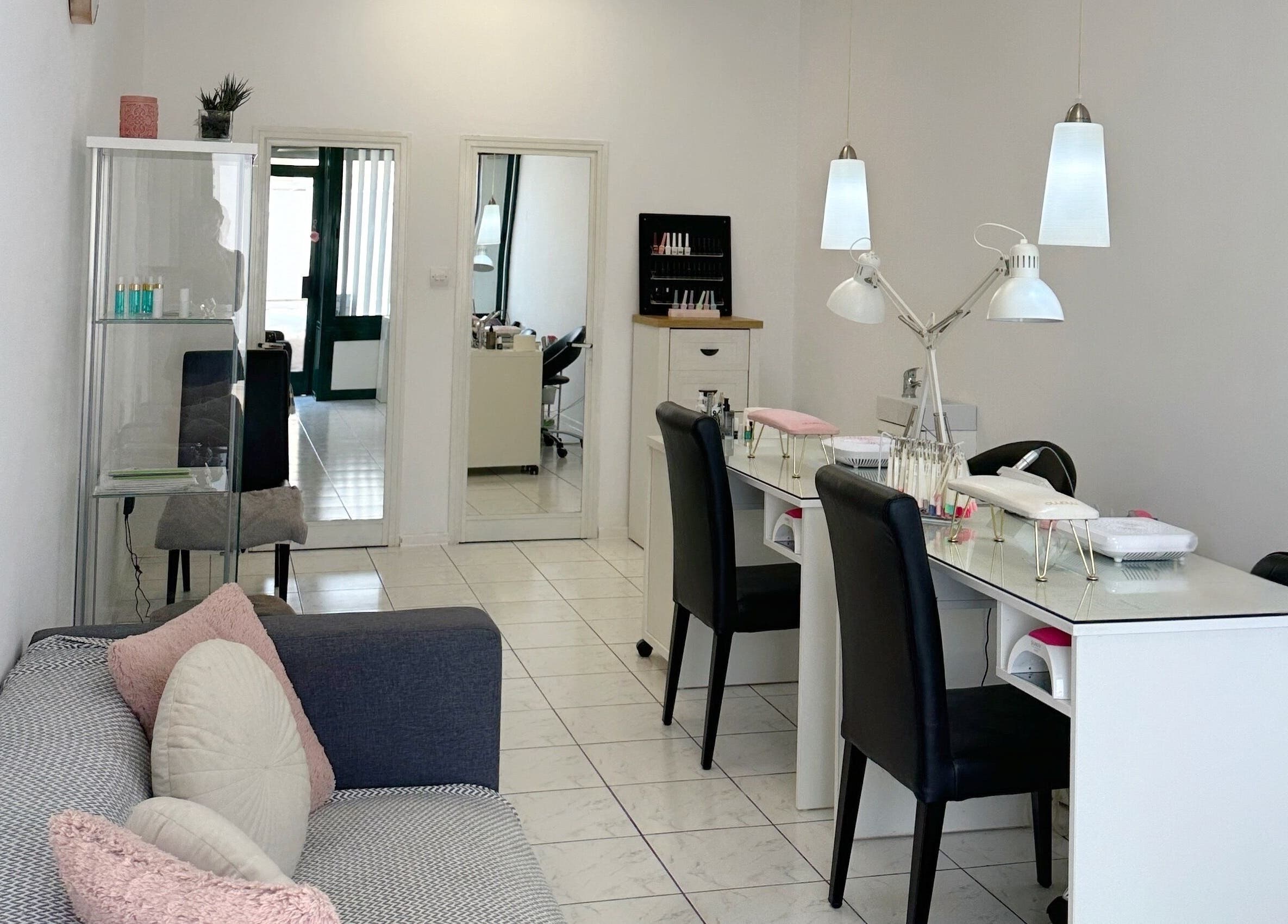 Cozy nail station at Shaped & Polished, Mosta, MT, with modern decor and comfortable seating.