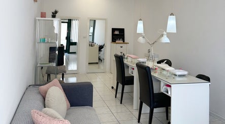Cozy nail station at Shaped & Polished, Mosta, MT, with modern decor and comfortable seating.