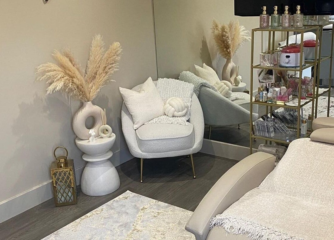 Elegant wellness room at Beauty Box By Zoe, Billingshurst, England, with plush seating and decor.