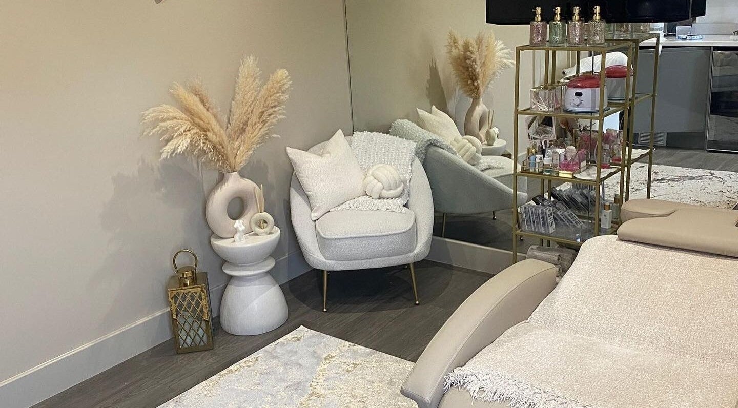 Elegant wellness room at Beauty Box By Zoe, Billingshurst, England, with plush seating and decor.