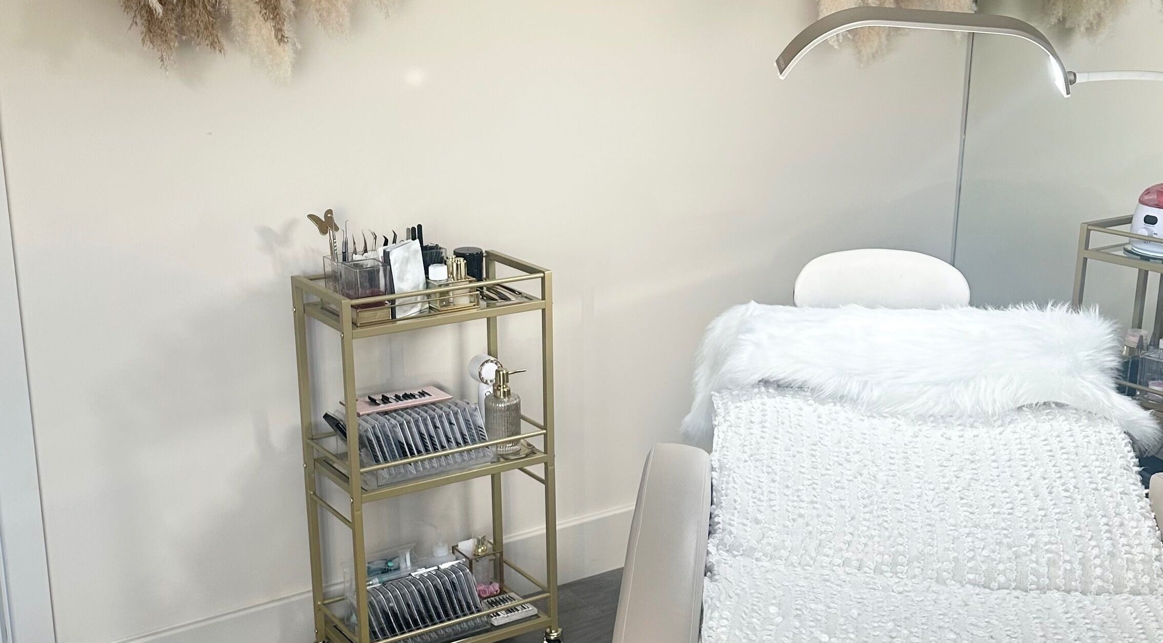Beauty Box By Zoe in Billingshurst, England features a serene treatment area with chic decor.