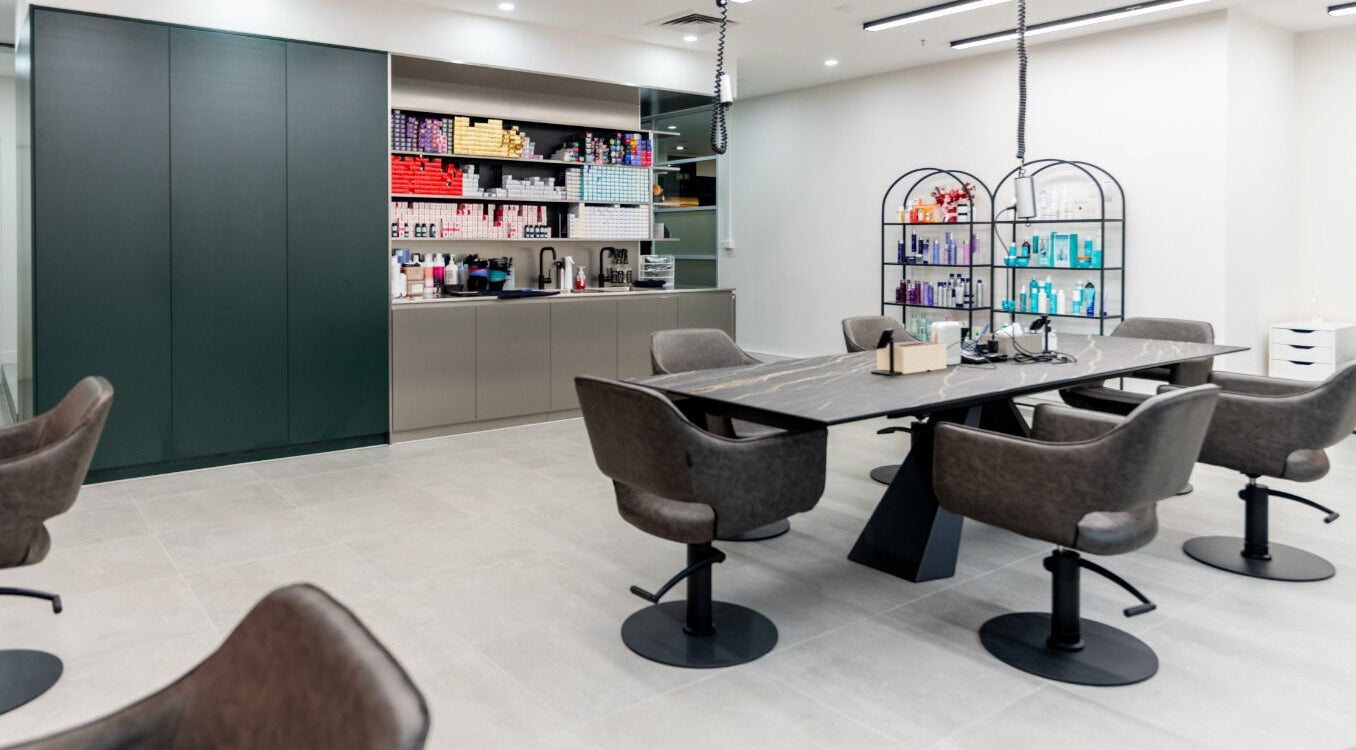 Sophisticated salon interior at Arinni Hair and Makeup, Melbourne, Victoria, AU, featuring modern styling chairs.
