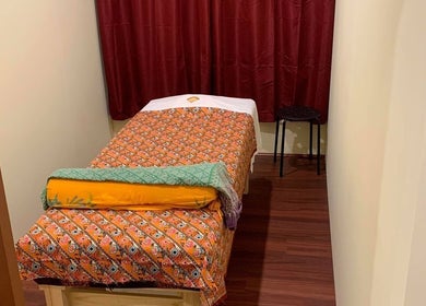 Cozy massage room at Freo Thai Massage, Fremantle, Western Australia, AU with vibrant patterned linens.