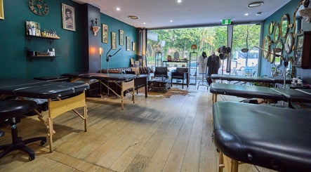Modern interior of The Hanged Man Tattoo & Barber in Manly, New South Wales, AU with tattoo stations and décor.