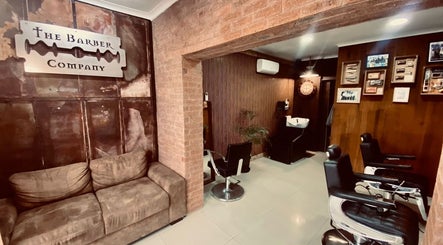 Cozy interior of Barber James in East London, Eastern Cape, ZA with vintage decor and comfortable seating.